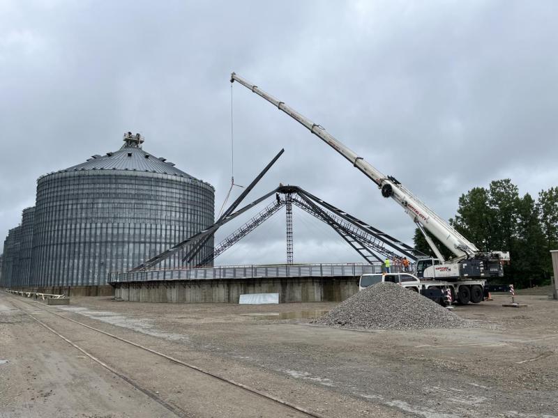 Roof rafters being set during construction of the new 157' diameter bin